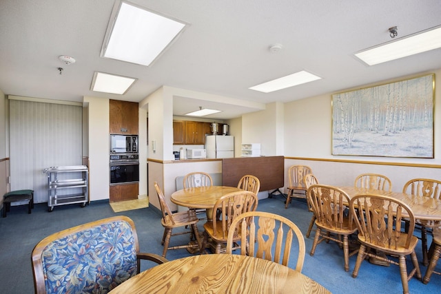 dining room with dark carpet