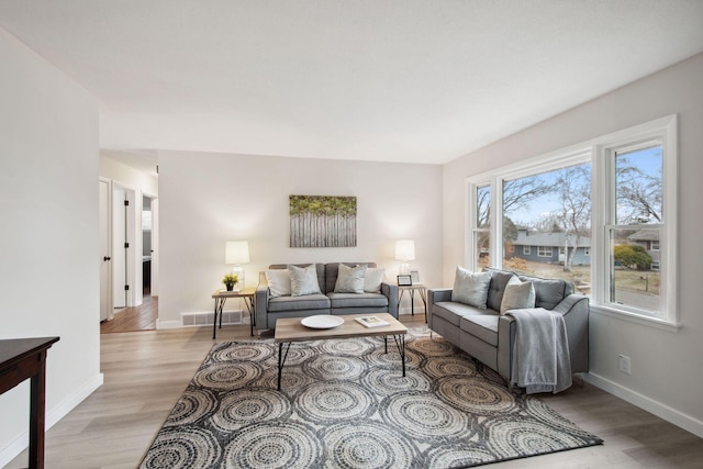 living room with light hardwood / wood-style floors