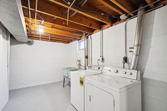 washroom with washer and clothes dryer and sink