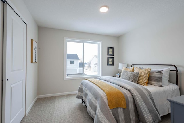 carpeted bedroom featuring a closet