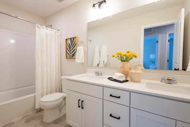 full bathroom featuring vanity, shower / bathtub combination with curtain, and toilet