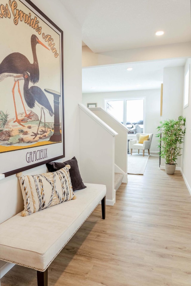 hall with light hardwood / wood-style flooring