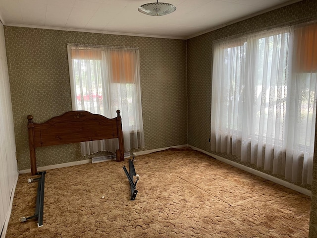 carpeted bedroom featuring crown molding