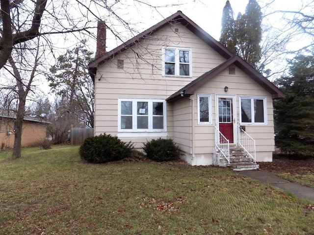 view of front of home with a front yard