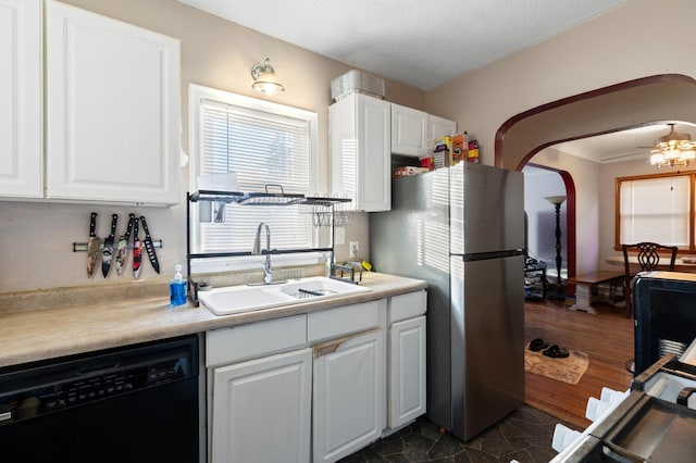 kitchen featuring dishwasher, dark hardwood / wood-style floors, white cabinetry, and stainless steel refrigerator