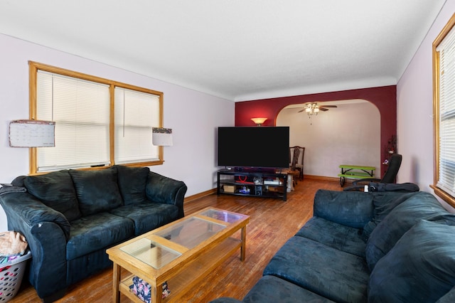 living room with hardwood / wood-style floors and ceiling fan