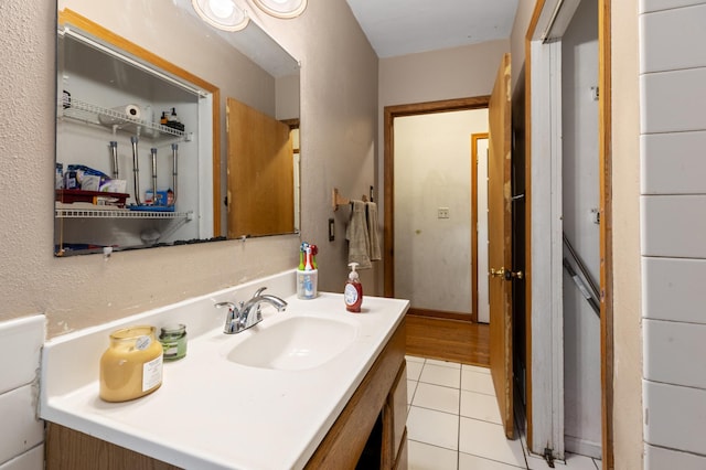 bathroom featuring tile patterned flooring and vanity