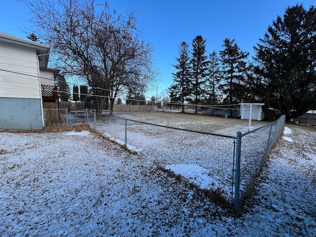 view of yard layered in snow