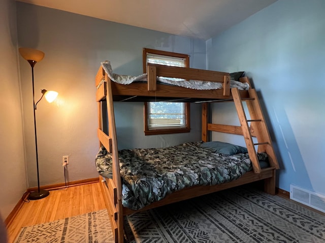 bedroom with hardwood / wood-style flooring