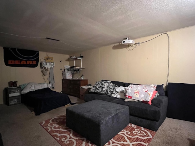 living room featuring carpet and a textured ceiling