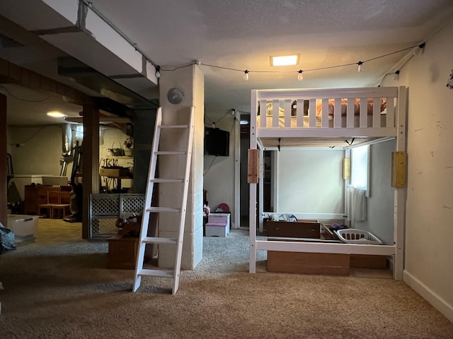 bedroom featuring carpet and a textured ceiling