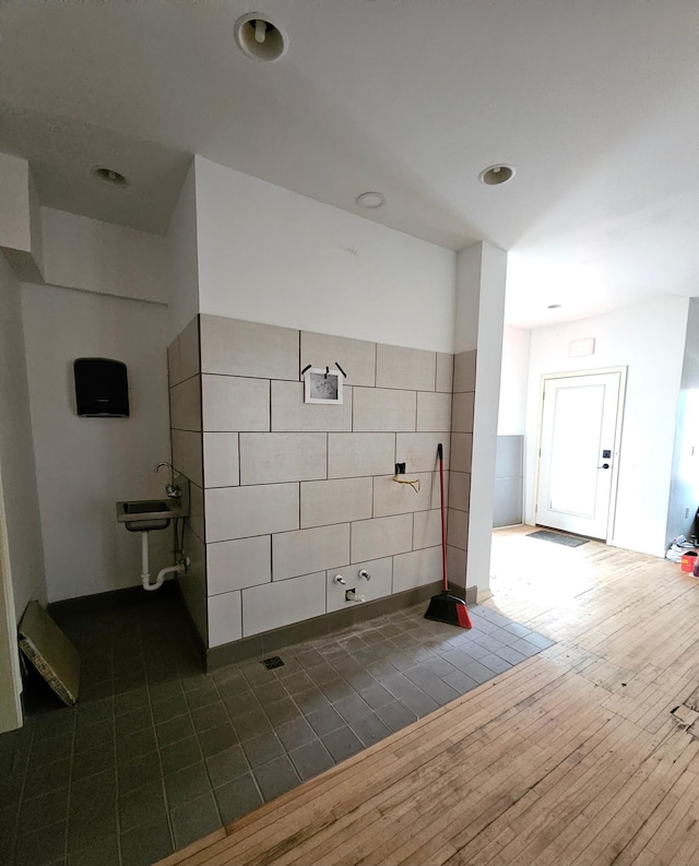 bathroom with hardwood / wood-style flooring