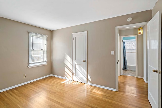 unfurnished room with light hardwood / wood-style flooring