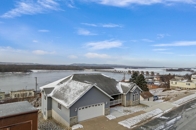 birds eye view of property with a water view