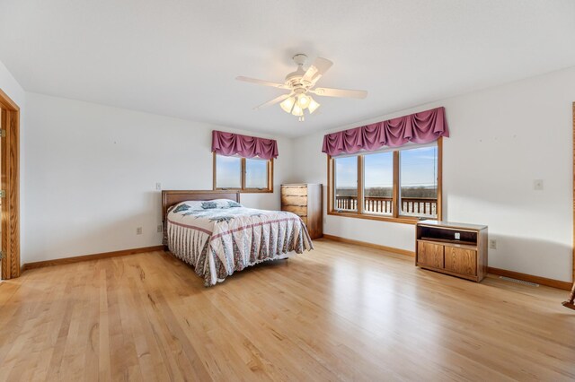 bedroom featuring light hardwood / wood-style floors and ceiling fan