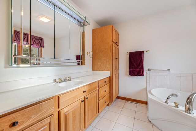 bathroom featuring vanity, a tub to relax in, and tile patterned floors