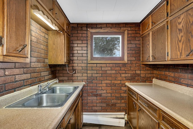 kitchen with sink and brick wall