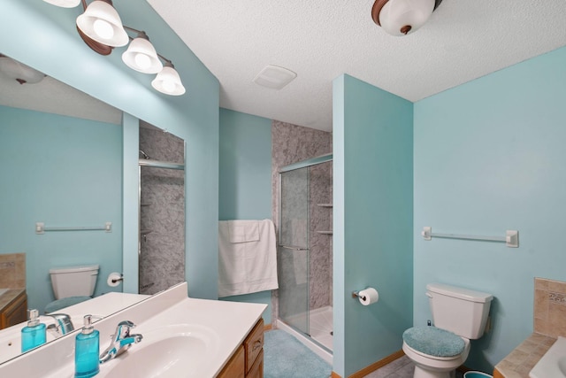 full bathroom with independent shower and bath, a textured ceiling, and toilet