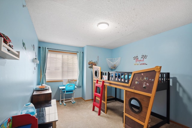 bedroom with light colored carpet and a textured ceiling