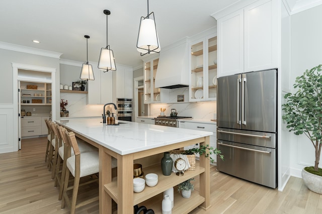 kitchen with crown molding, open shelves, custom range hood, appliances with stainless steel finishes, and white cabinets