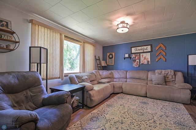 living room with ornamental molding and hardwood / wood-style flooring