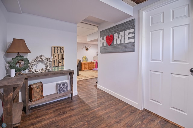 corridor with dark hardwood / wood-style flooring