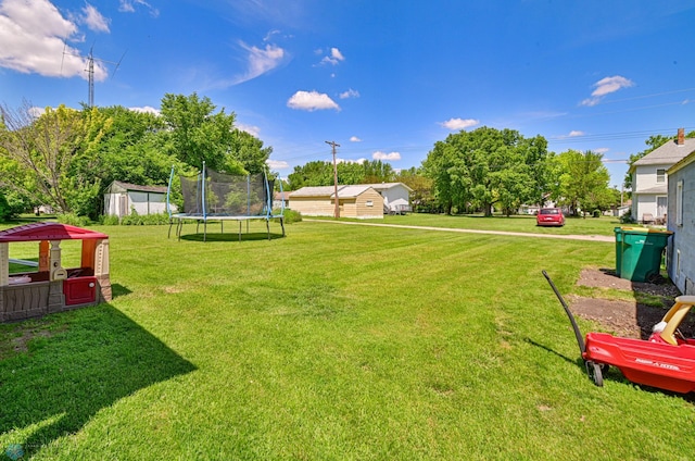 view of yard with a trampoline