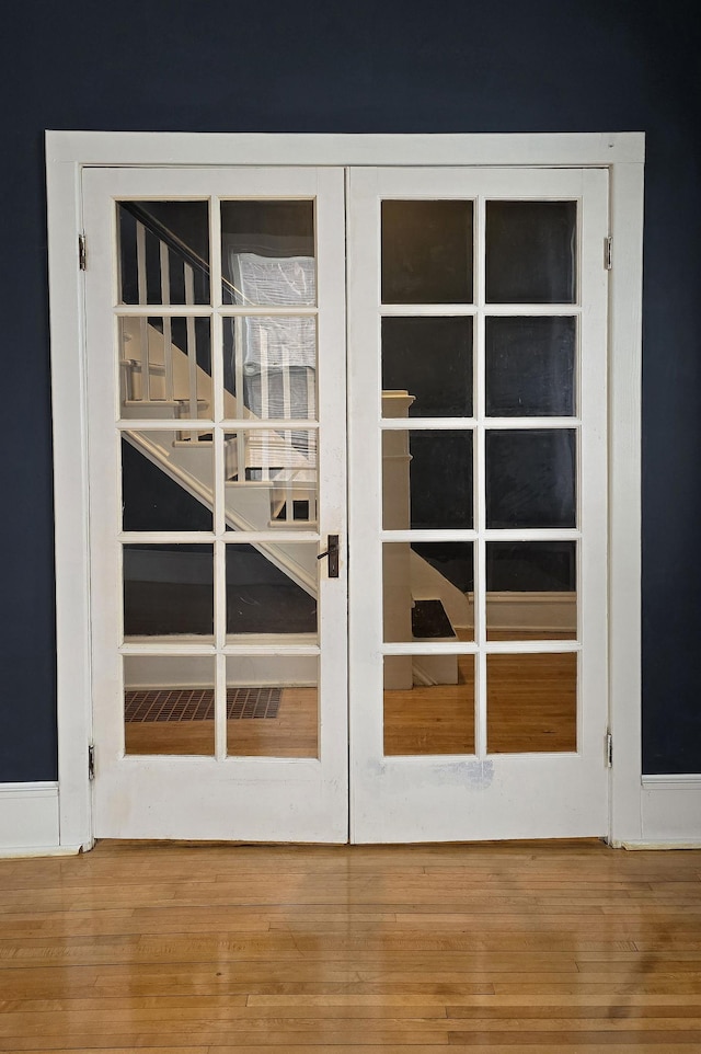 room details featuring hardwood / wood-style floors and french doors