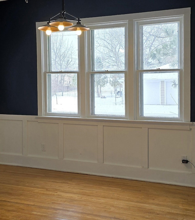 interior space with light hardwood / wood-style flooring and plenty of natural light