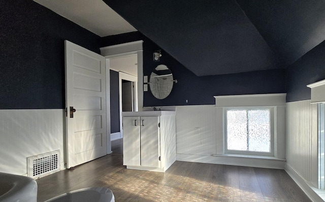 interior space with wood-type flooring and lofted ceiling