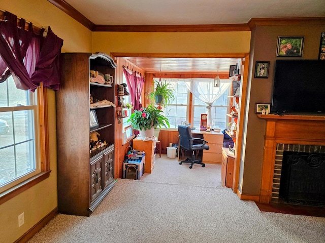 carpeted office space with a brick fireplace and ornamental molding