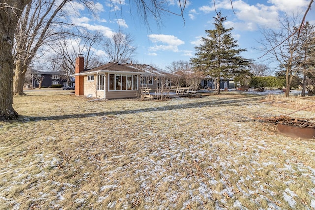 rear view of house with a sunroom