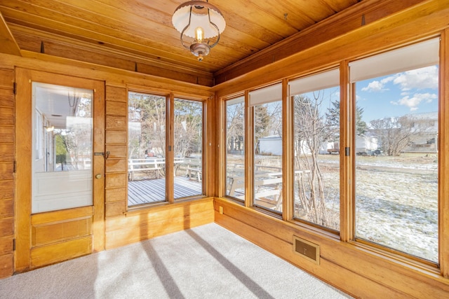 unfurnished sunroom with wood ceiling