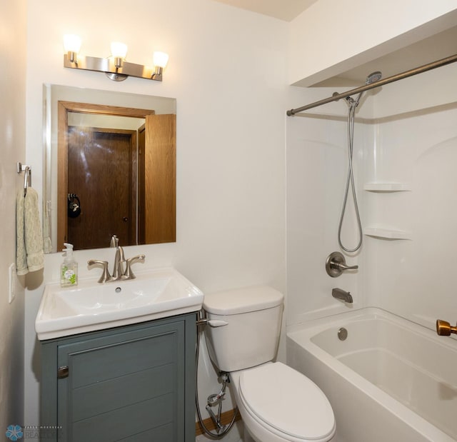 full bathroom featuring shower / bathing tub combination, vanity, and toilet