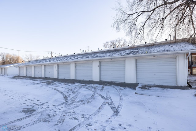 view of snow covered garage