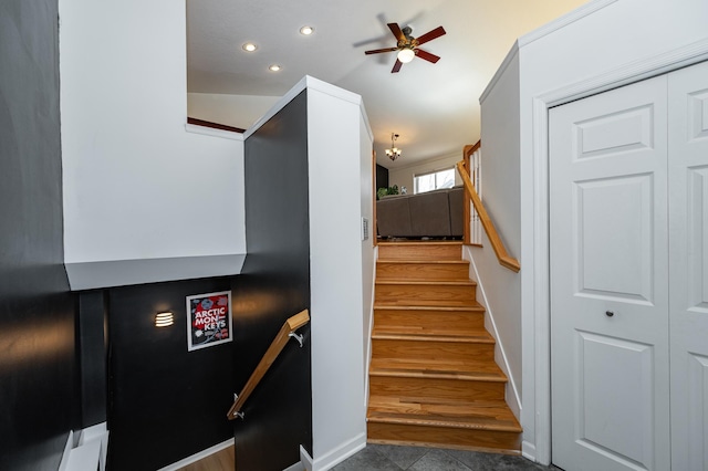 staircase with recessed lighting and ceiling fan