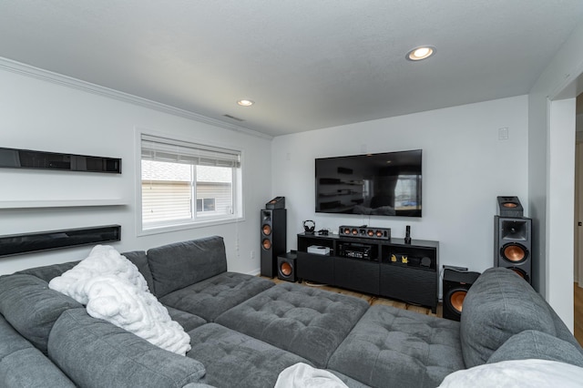 living area featuring crown molding, wood finished floors, recessed lighting, and visible vents