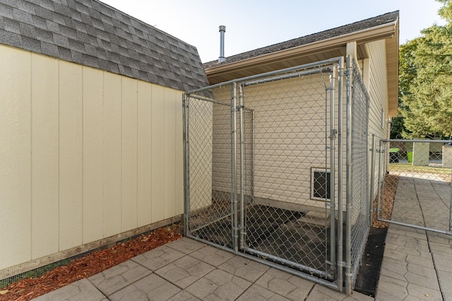 view of outdoor structure featuring an outdoor structure and a gate