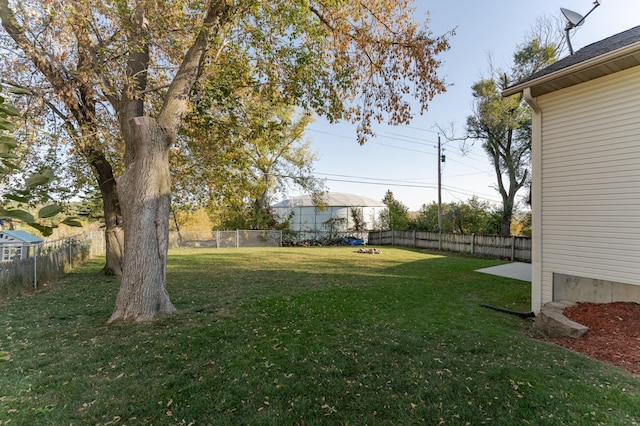 view of yard with a fenced backyard