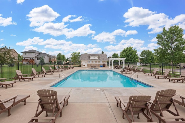 view of swimming pool featuring a patio area and a pergola