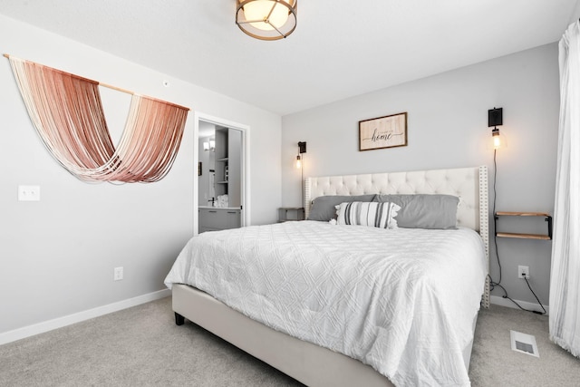 bedroom with light colored carpet, visible vents, and baseboards