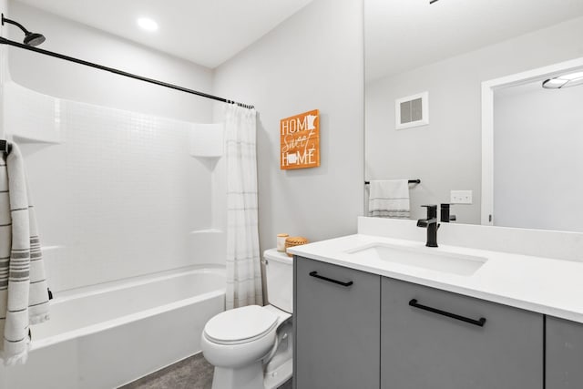 bathroom featuring shower / bath combination with curtain, visible vents, vanity, and toilet