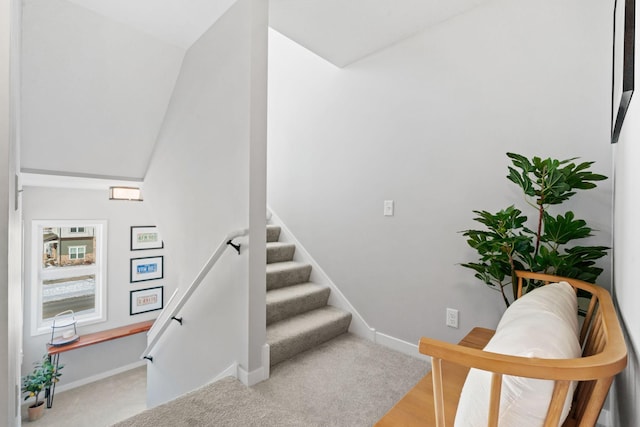 staircase featuring baseboards