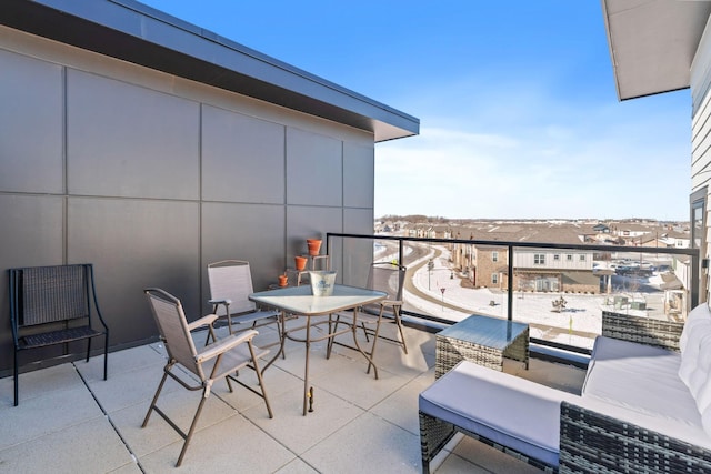 balcony with an outdoor hangout area and a residential view