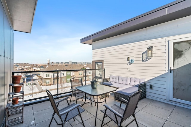 balcony with outdoor lounge area and a residential view