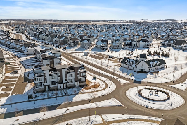 snowy aerial view featuring a residential view