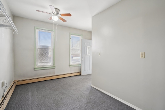 carpeted empty room with baseboard heating and ceiling fan