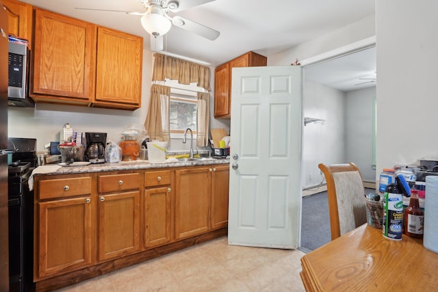 kitchen with baseboard heating and sink