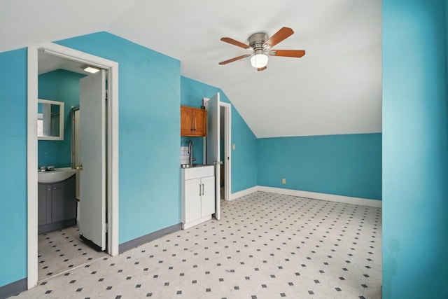 bonus room with ceiling fan, lofted ceiling, and sink