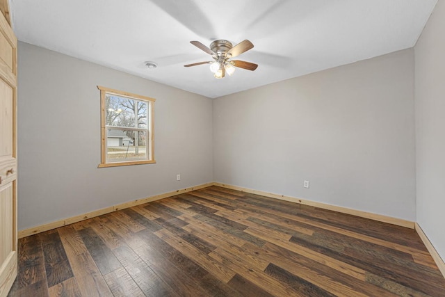 unfurnished room with ceiling fan and dark hardwood / wood-style floors